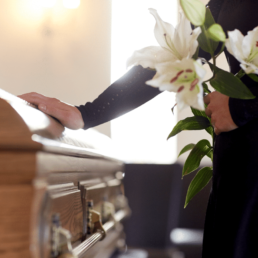 Woman with flowers at a funeral