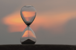 hourglass with background sunset