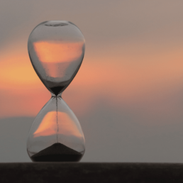 hourglass with background sunset