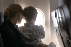 Mom and son on airplane